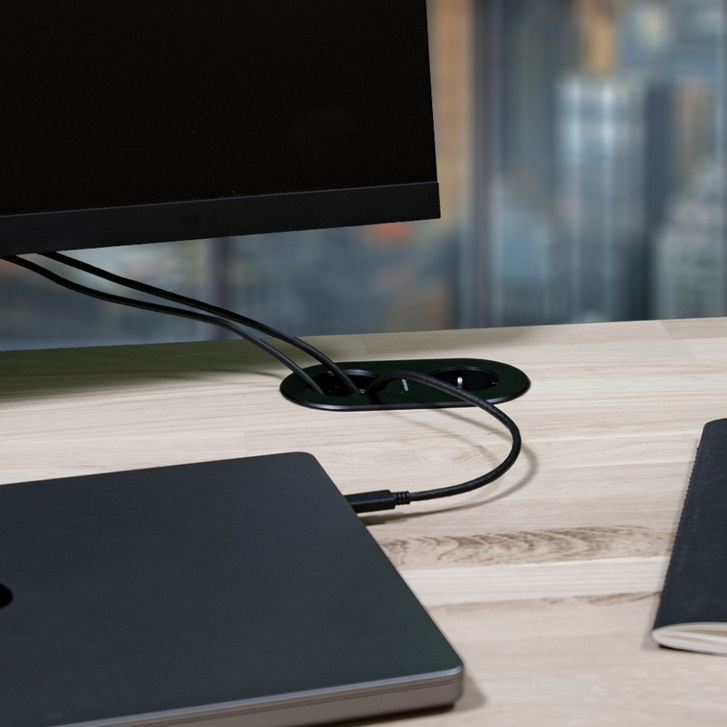 CARIQ XS with a cable grommet and a socket.
